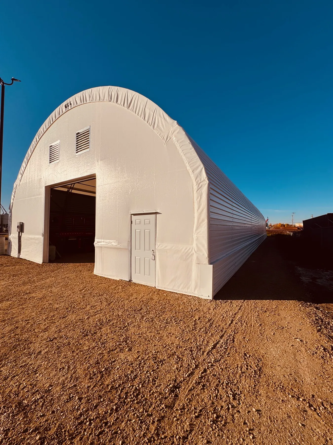 60 by 100 foot fabric equipment storage building with fire-rated walls in Stony Plain, Alberta