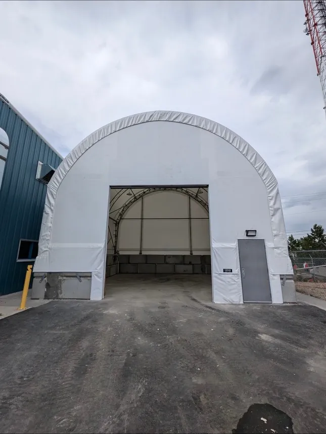 30 by 60 foot fabric building installed beside an existing steel building in Airdrie, Alberta