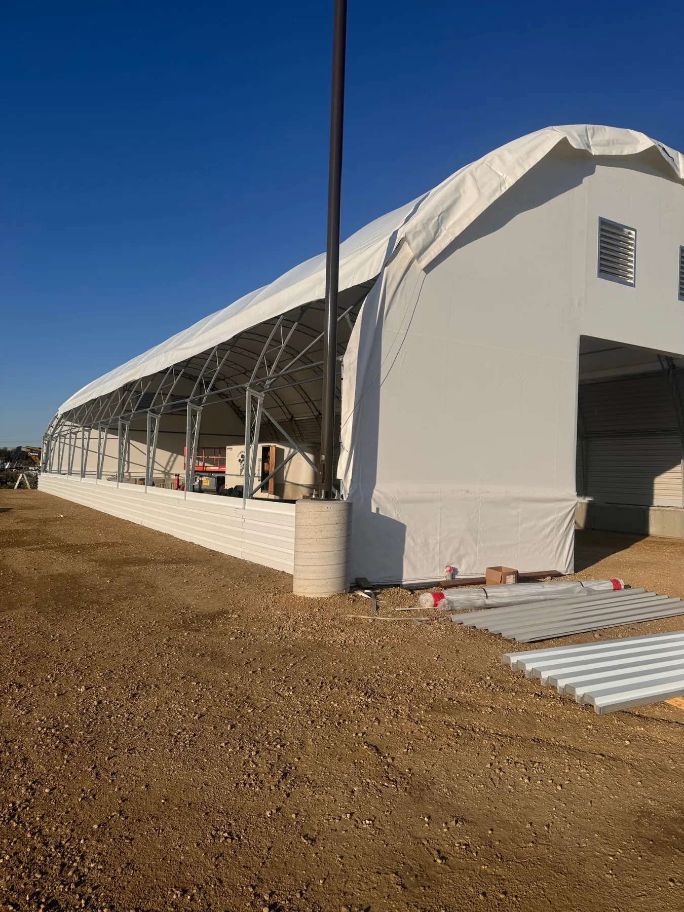 Stony Plain equipment storage building during installation, with cover and fire-rated wall panels going on