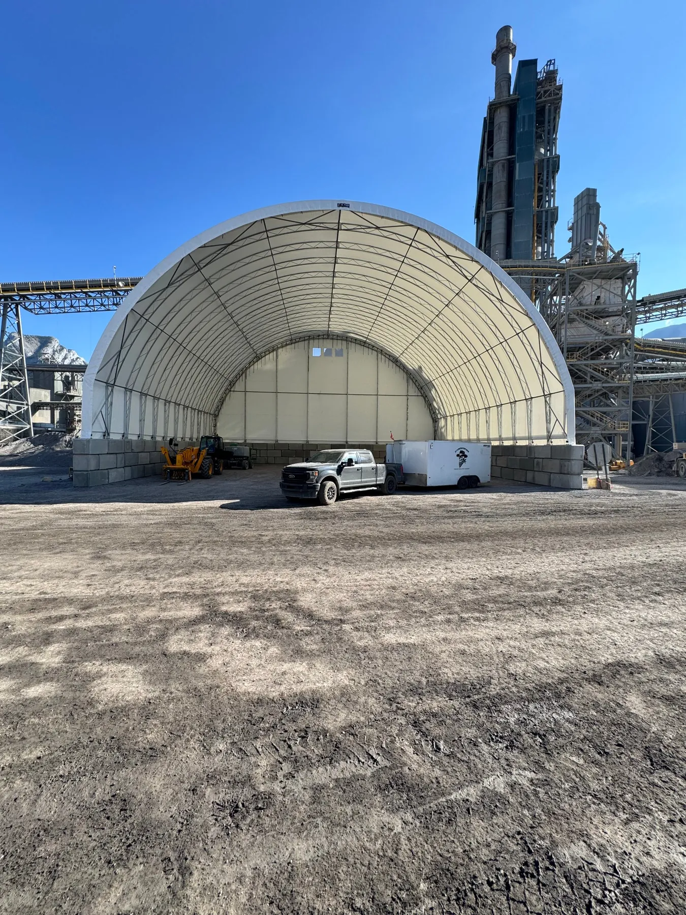 80 by 120 foot open-end fabric bulk storage building for fly ash in Exshaw, Alberta