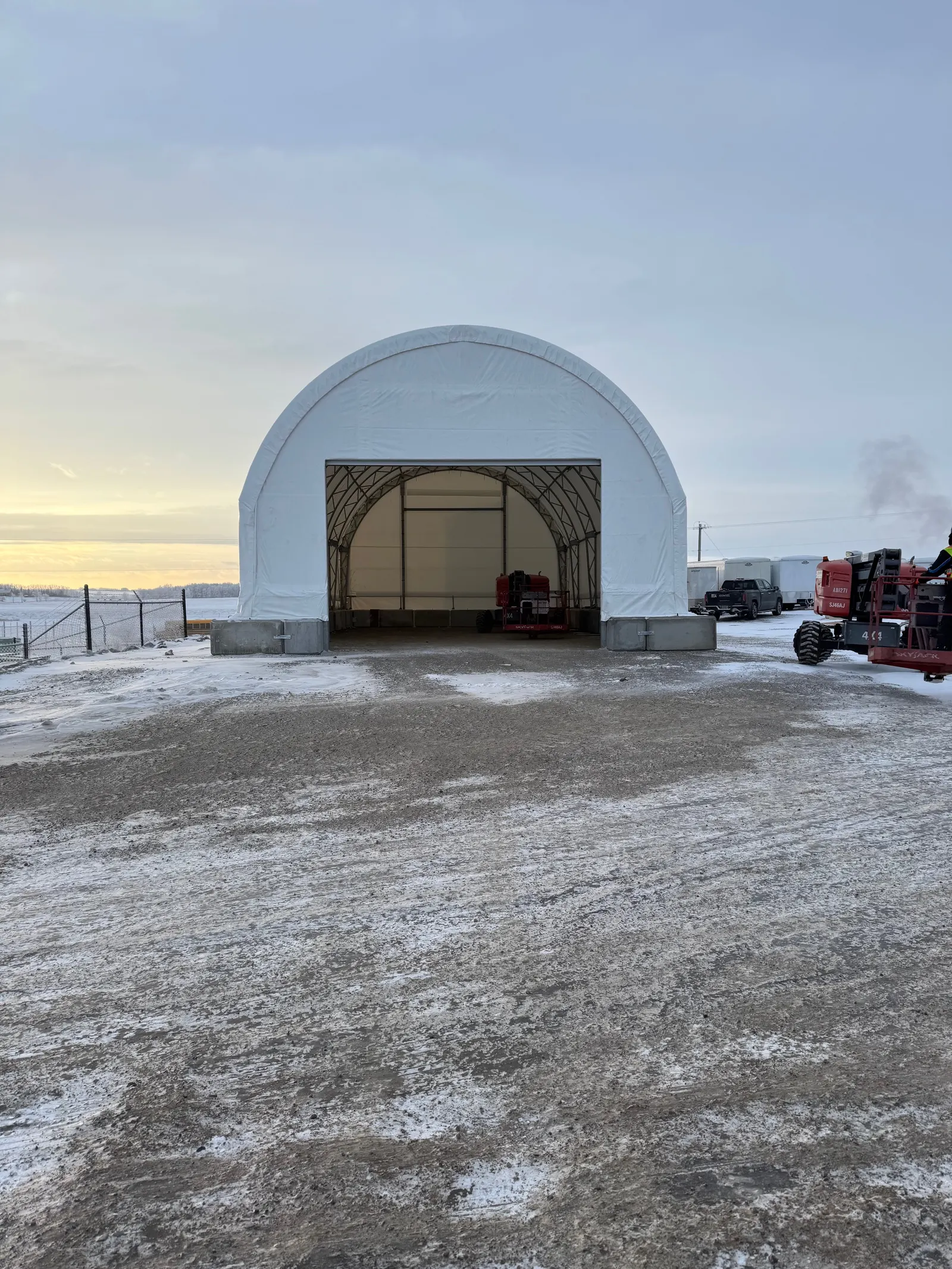 Fabric dome building winter installation with lift crews