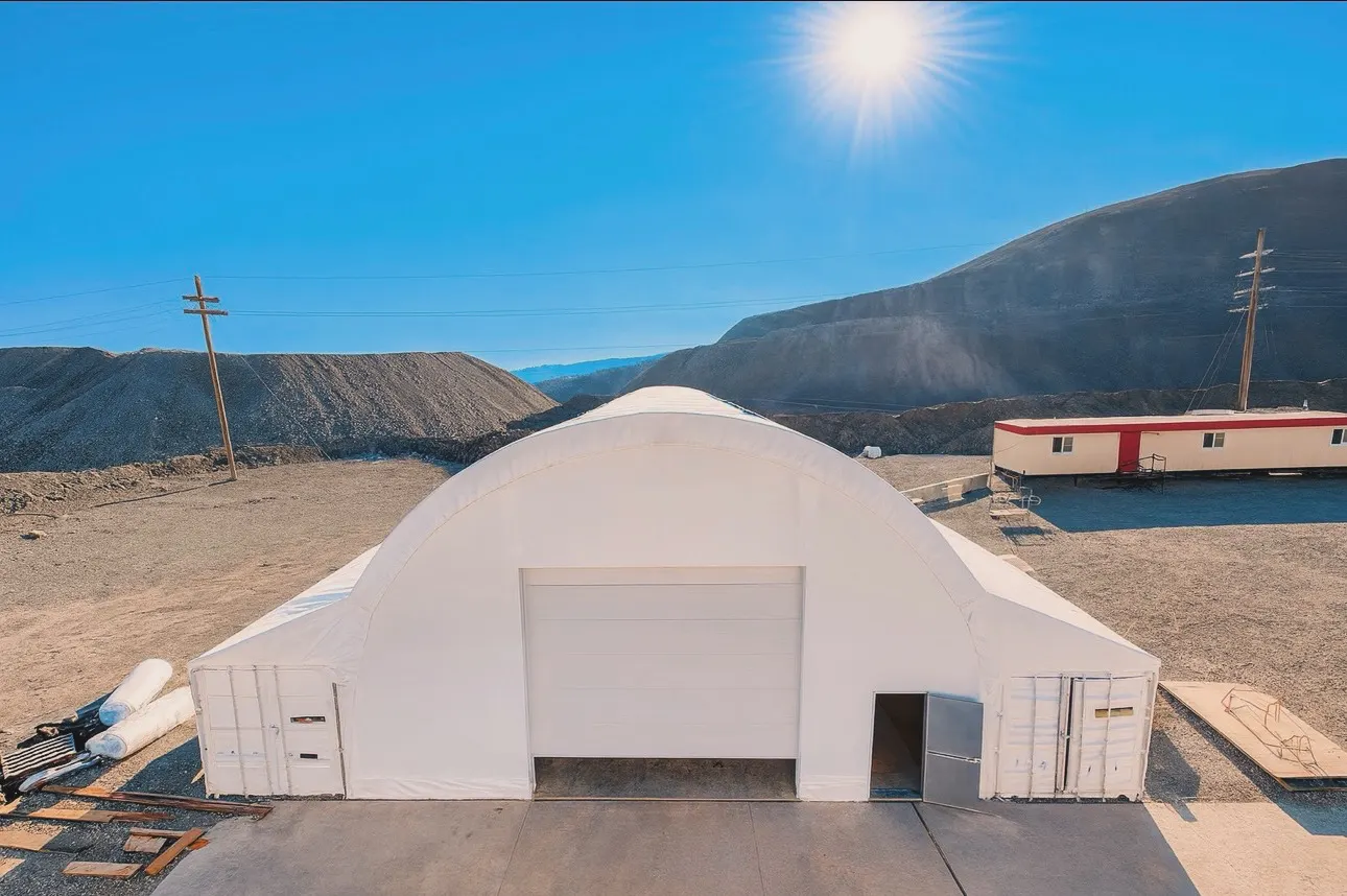 Completed fabric storage building with overhead door on the Princeton BC mine site