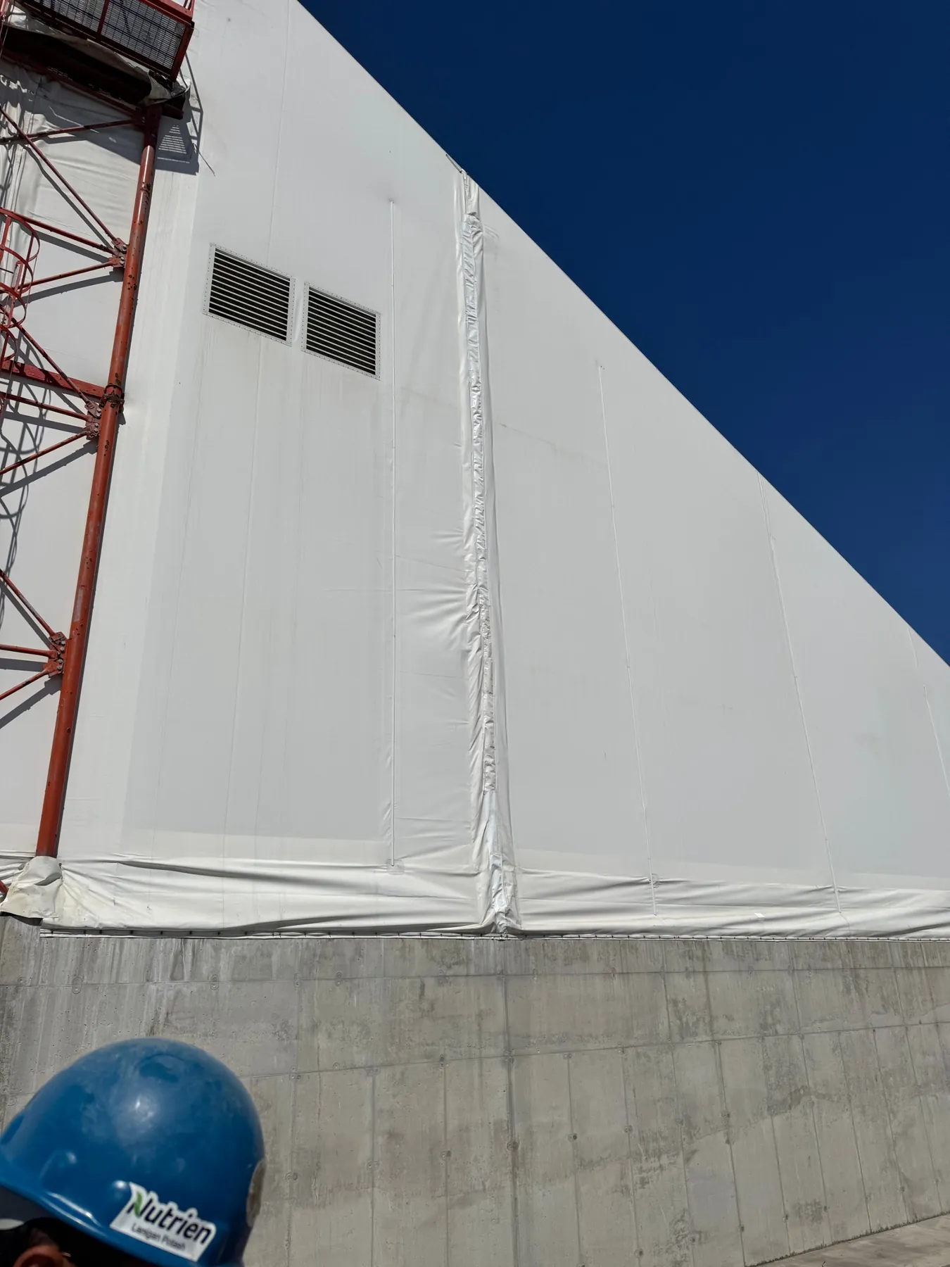 Fabric building end wall after a tear repair in Saskatchewan