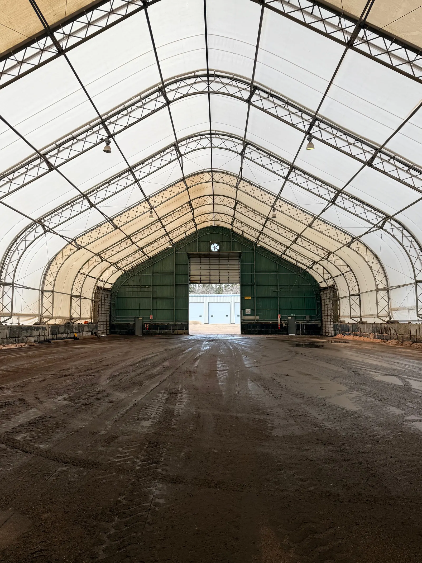 Interior of a clear-span fabric salt and sand storage building